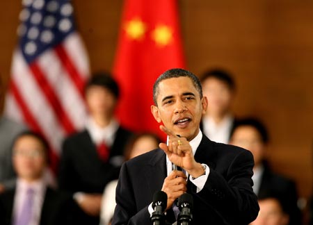 U.S. President Barack Obama gestures as he delivers a speech at a dialogue with Chinese youth at the Shanghai Science and Technology Museum during his four-day state visit to China, Nov. 16, 2009.