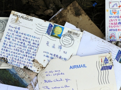马航MH17残骸惊现中文明信片 收件人是台湾男子_台湾万象_中国台湾网